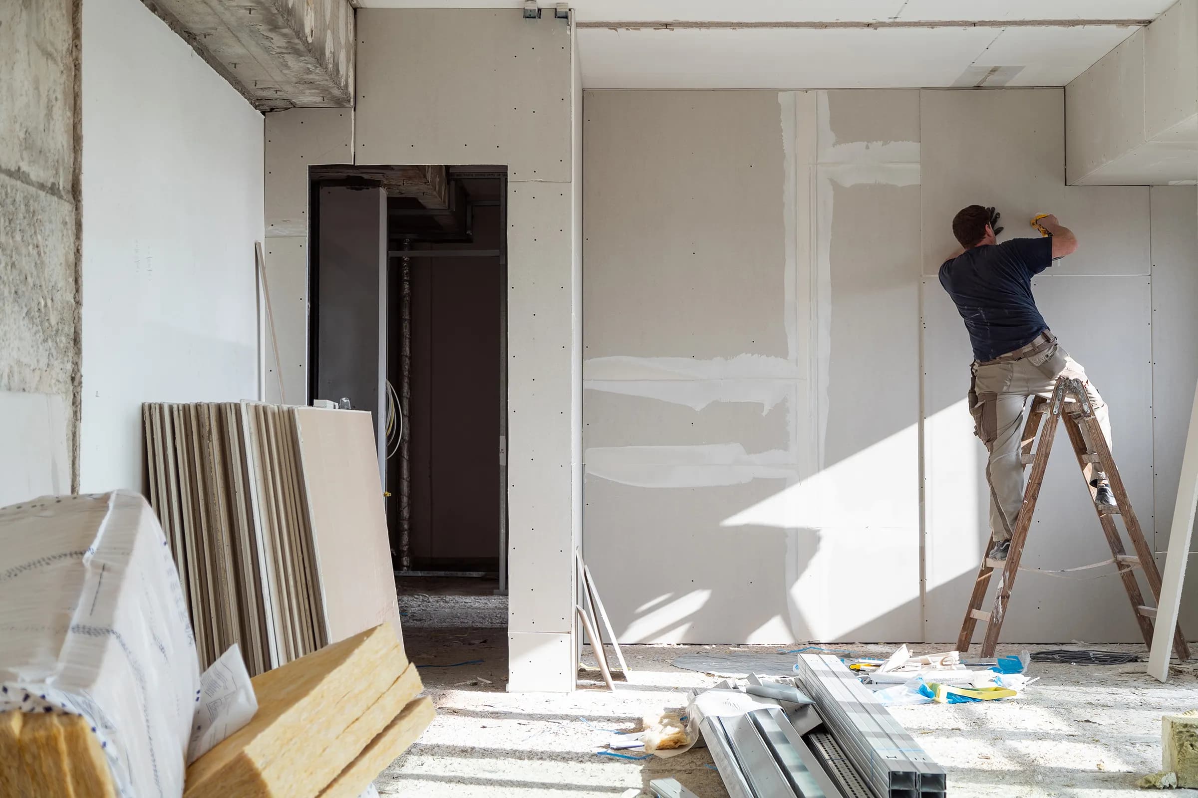 Qualified contractor inspecting the progress of a remodeling