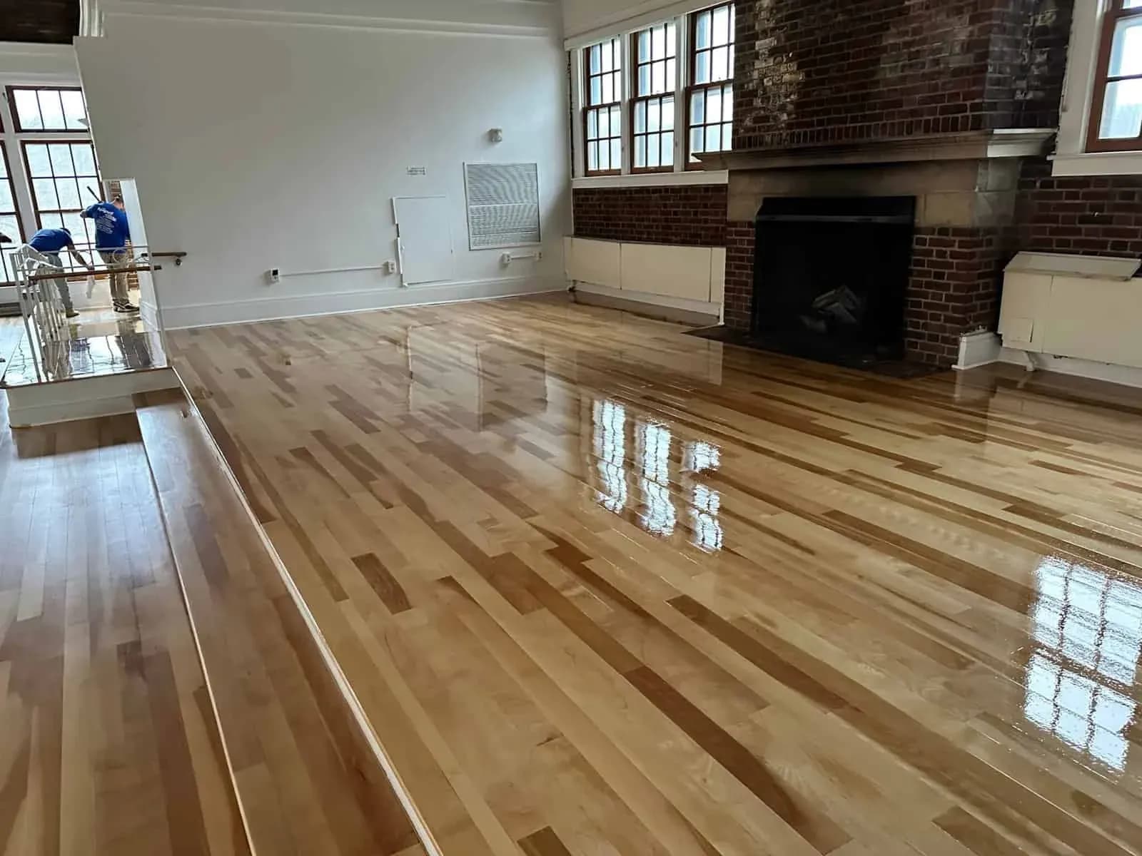 Living room in New York with light wood flooring